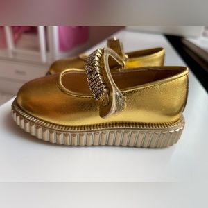 Moschino gold shoes. Never worn